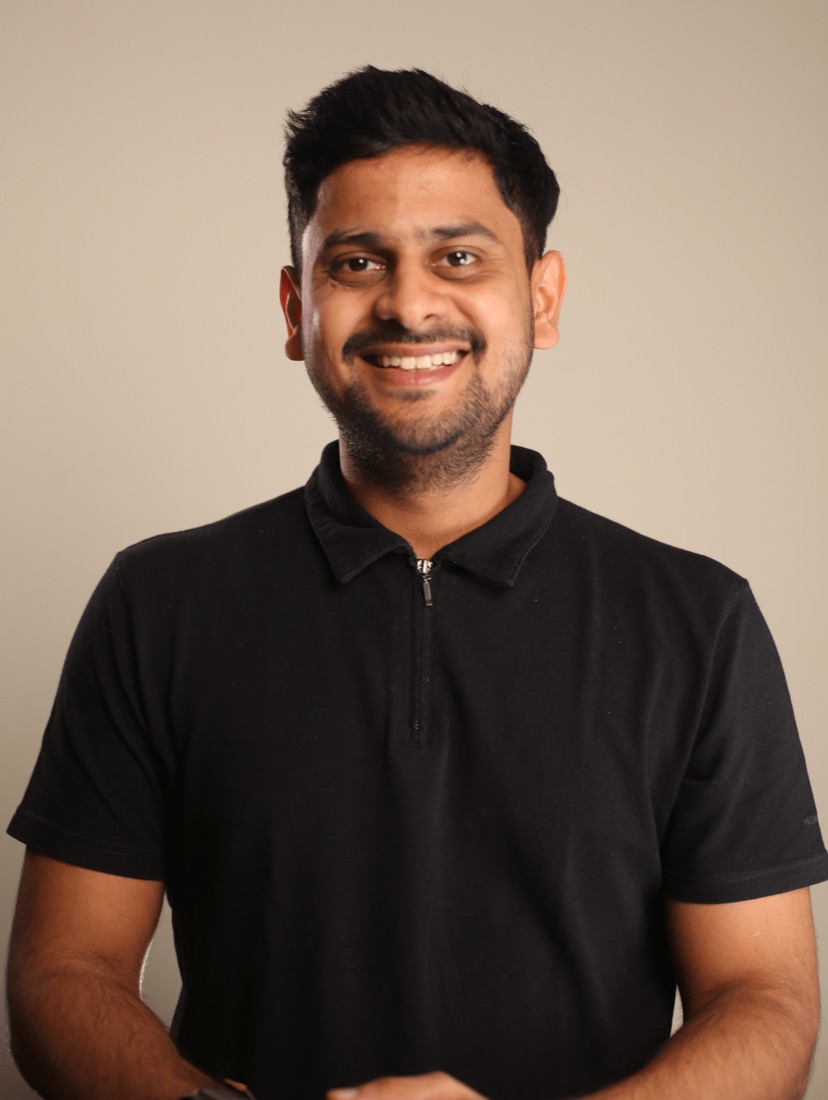 Pankaj Bokdia, smiling, in a black shirt.